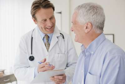 Doctor and patient in exam room for a physical