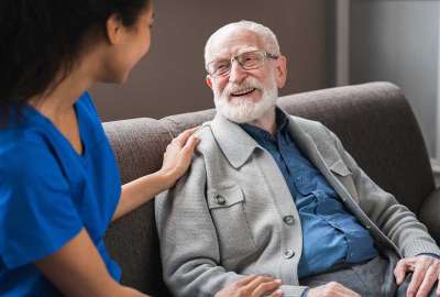 Three Rivers Concierge Medicine doctor comforting elderly male patient in St. Louis, MO